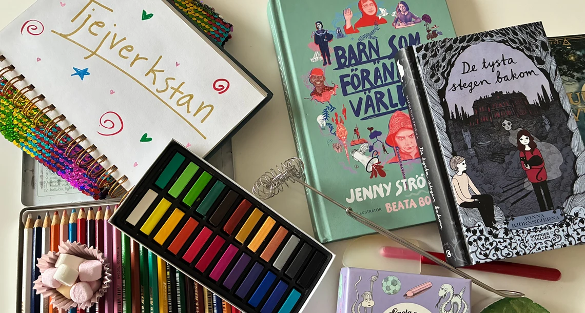 Bord med olika material, till exempel färger, böcker med mera